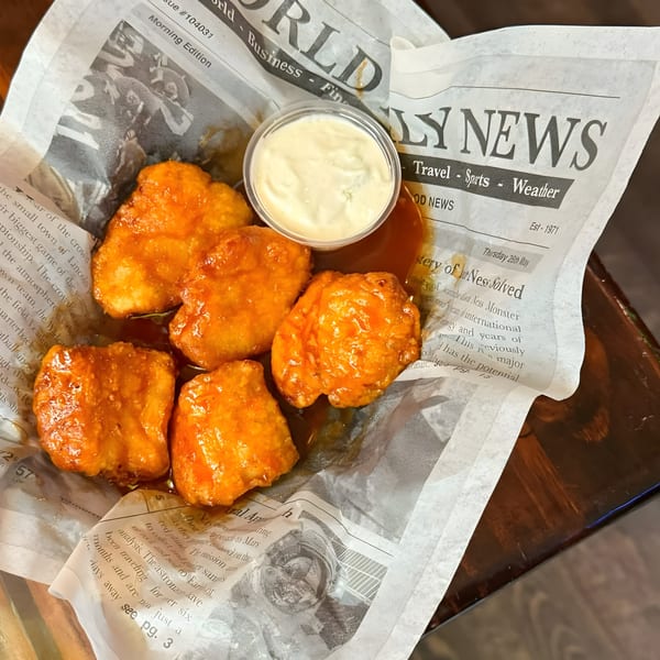 Crawford's Corner Bar & Kitchen's boneless wings with buffalo sauce and a side of ranch dressing.